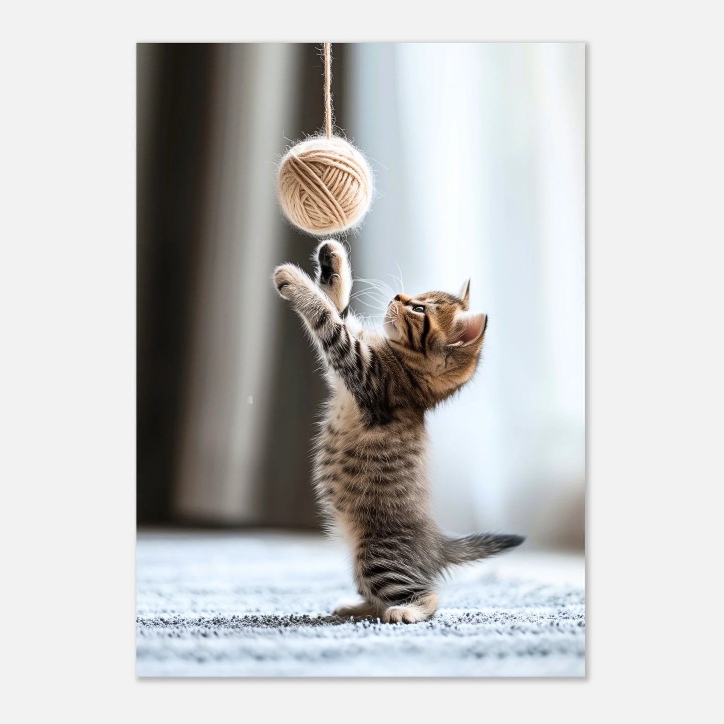 Poster of playful kitten jumping for yarn – perfect cat print for kids or pet lovers