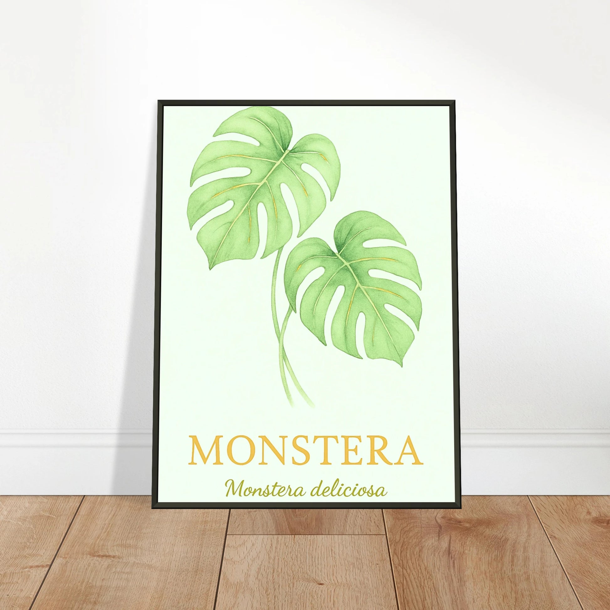 Monstera Poster an die Wand gelehnt – stilvolles botanisches Kunstwerk im schwarzen Metallrahmen, perfekt für moderne Wohnräume.
